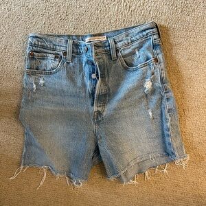 Levi's Light Blue Distressed Denim Shorts high rise - rib cage fit.